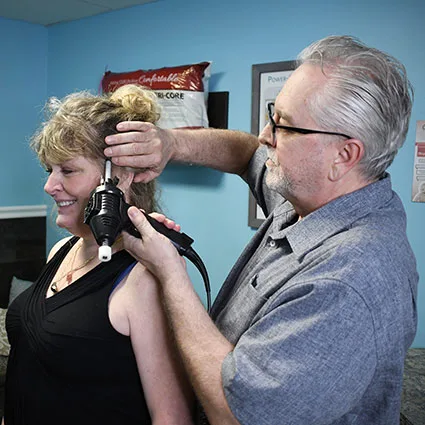 Dr Johr adjusting persons jaw