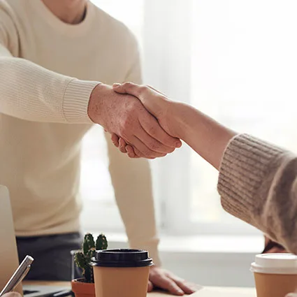 two people shaking hands
