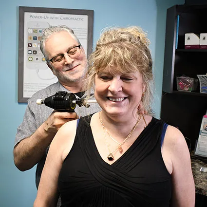 Dr. John Johr performing a neck adjustment